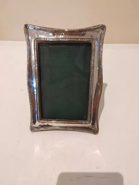 An antique rectangular shaped Edwardian border sterling silver photo frame