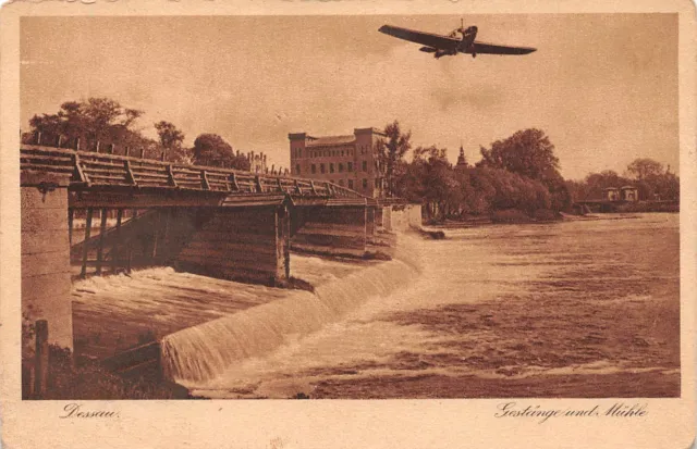 AK Postkarte Dessau Gestänge und Mühle mit Junkersflugzeug 1930