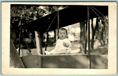 RPPC Adorable Chubby Baby Sitting On Airplane Toy UNP 1910s AZO Postcard H5