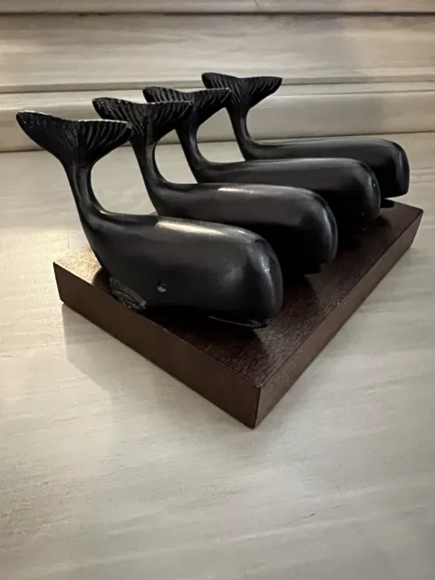 Vintage solid cast Sperm Whale metal paperweights with wooden stand, Set Of 4