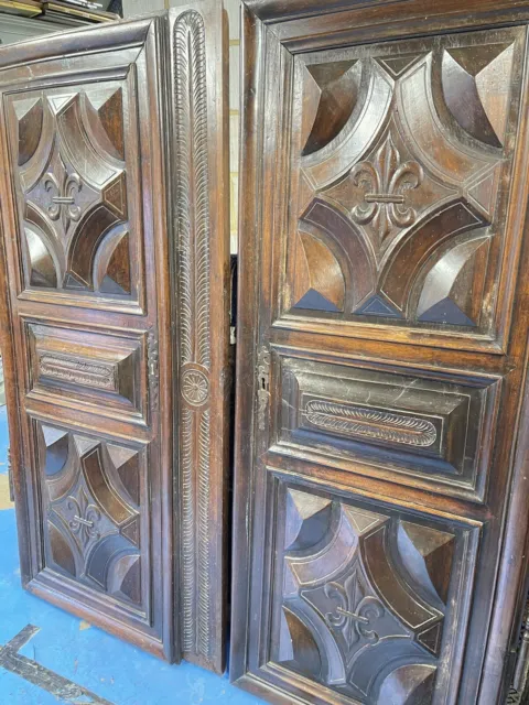 A Pair Of French 18th Century Walnut Pair Of Doors With a deep surround