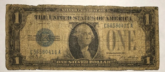 1928 $1 Funnyback blue seal silver certificate FR1600. G-VG, soil & fray. #nd7
