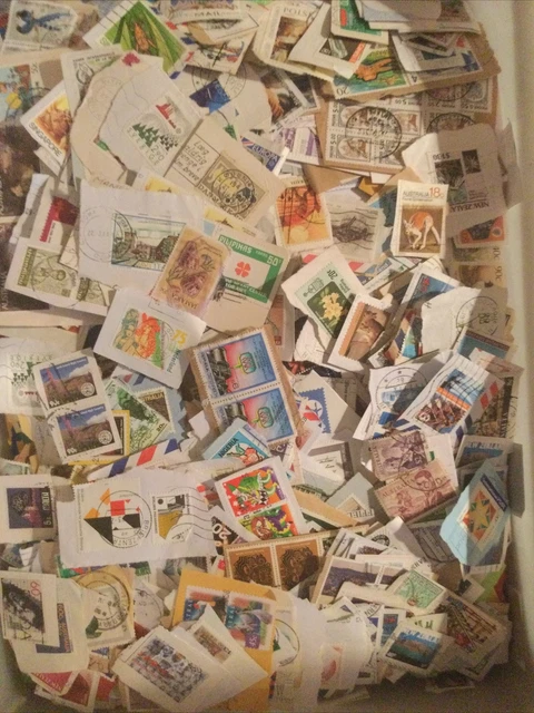 World Stamps on paper close cut Kiloware Many  better values 300 grams