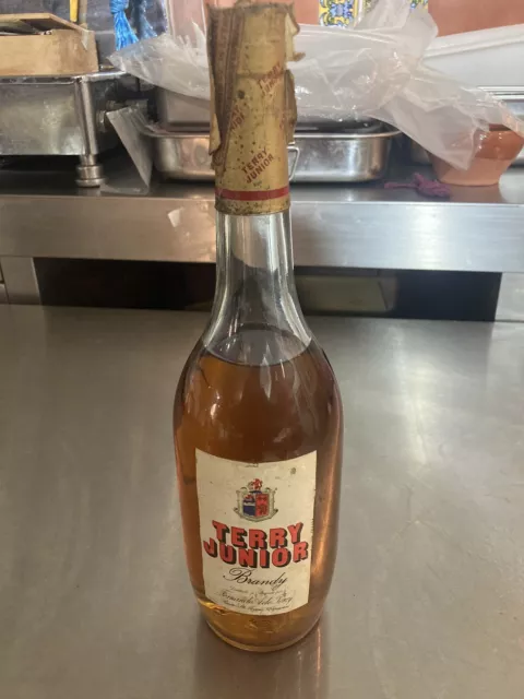 Botella antigua de brandy terry junior .