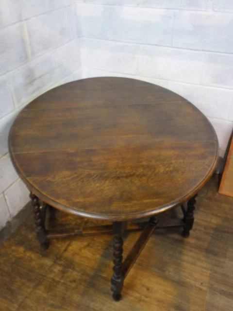 SOLID OAK OVAL DROP LEAF DINING TABLE With BARLEY TWIST SUPPORTS.