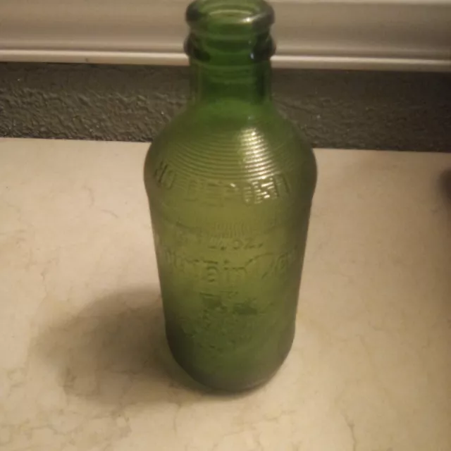 Vintage 1965 Mountain Dew  Bottle 10oz Embossed " IT’LL TICKLE YORE INNARDS"