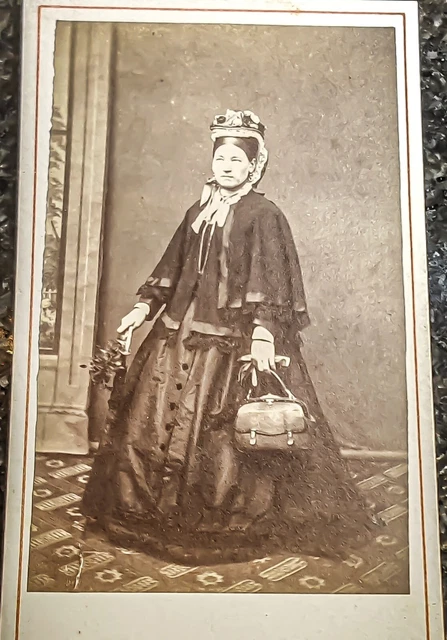 CDV photo portrait of woman with handbag, mid 19th century.
