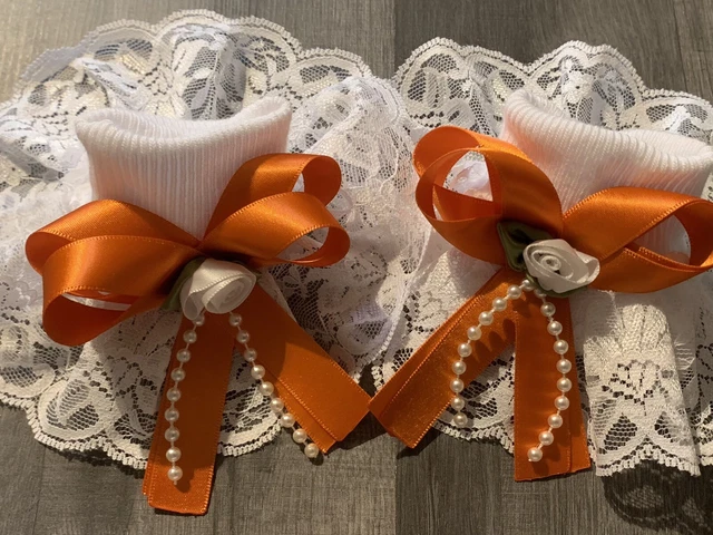 Calze frilly romane/spagnole taglia 9-12 fiocco arancione e fiore bianco