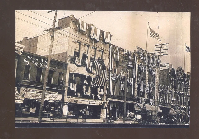 Real Photo Olean New York Downtown Patriotic Street Scene Postcard Copy