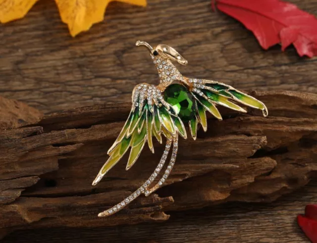 Broche bijou Oiseau style phoenix en acier doré et pierre cristal vert