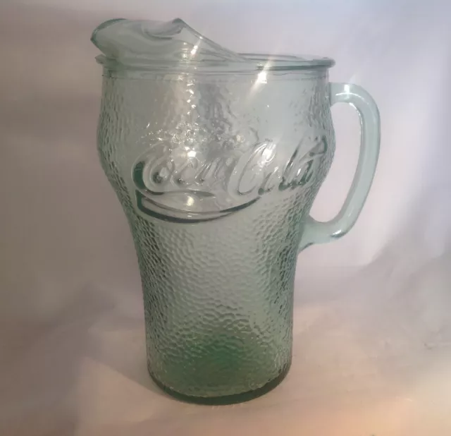 https://www.picclickimg.com/obgAAOSwYcJgOB6S/Indiana-Glass-Green-Coca-Cola-Pitcher-Pebble-Glass.webp