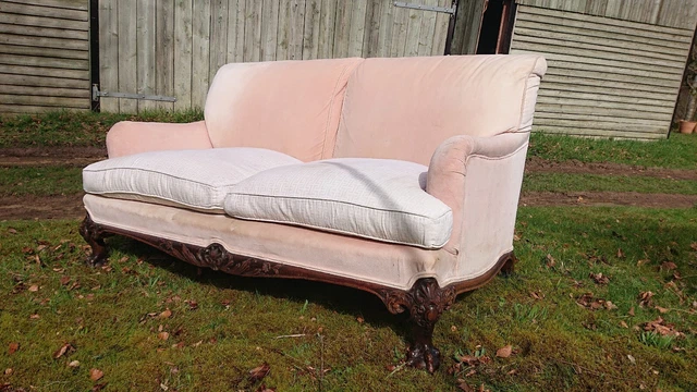 howard and sons sofa on carved ball and claw feet, fabric worn but comfortable!