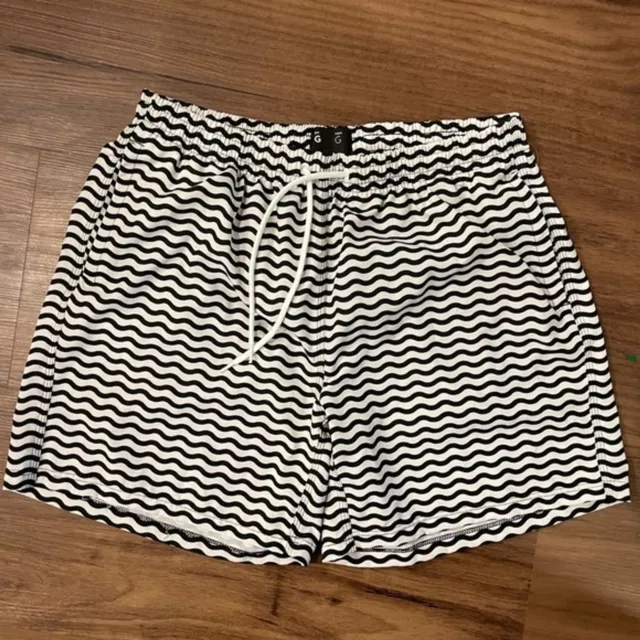Men’s swim shorts. Black and white wavy pattern with drawstring. Pockets. Size L