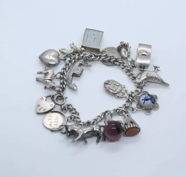 Heavy Vintage .925 Solid Silver Charm Bracelet - 16 charms, 54.94 g