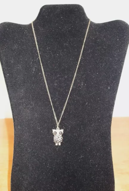 Owl charm pendant necklace on a gold coloured metal chain