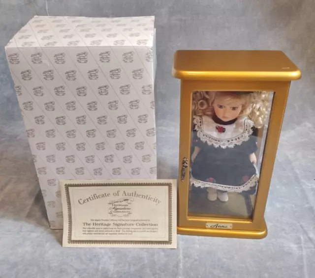 Heritage Signature Collection Blonde Anna Porcelain Doll in Wood Display Cabinet