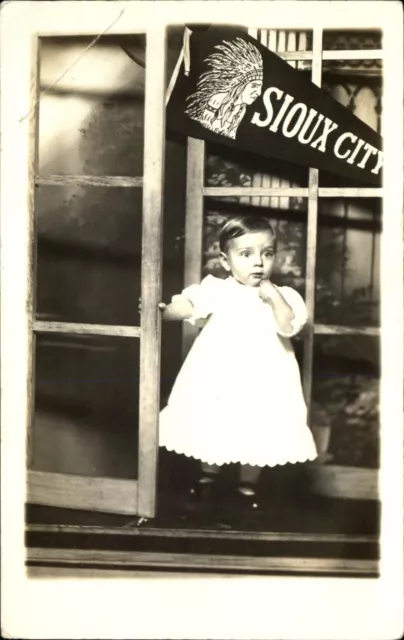 Toddler ~ SIOUX CITY Iowa pennant ~ Indian headdress~ RPPC real photo 1904-1918