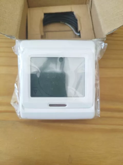 M9. 716 Period Touch Screen Thermostat.