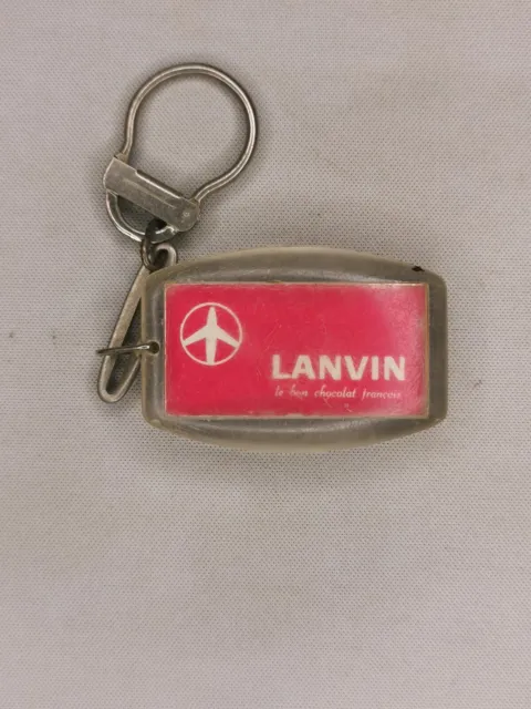 Porte clef forme avion publicitaire chocolat Lanvin