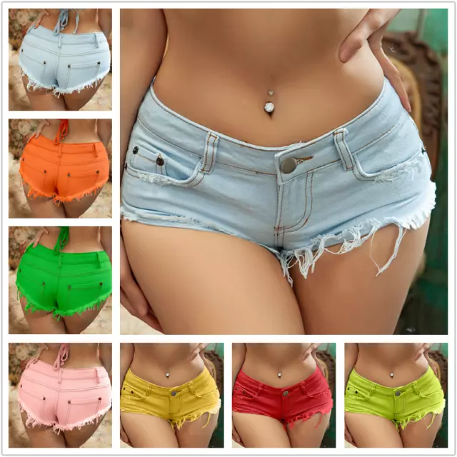 mid section of young woman wearing denim hot pants or booty shorts., belly  button piercing and orange nail polish. fashion trend. Stock Photo | Adobe  Stock
