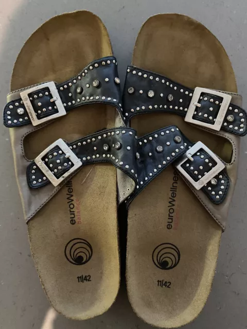 Eurowellness blackleather with rivets and rhinestone buckle womens sandles Sz 42