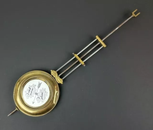 83/01 Antico pendolo in ottone  per orologio a pendolo o da parete