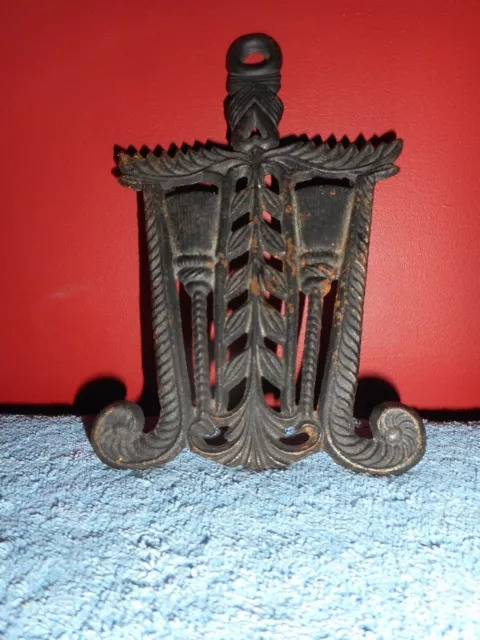 Old Cast Iron Trivet Spoon Rest Brooms and Feather Scrolls 8 1/2" X 5" Large