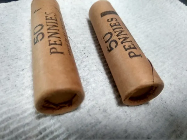 Pennies1964d 2 rolls unc still have caps on one end Lincoln pennies did not open