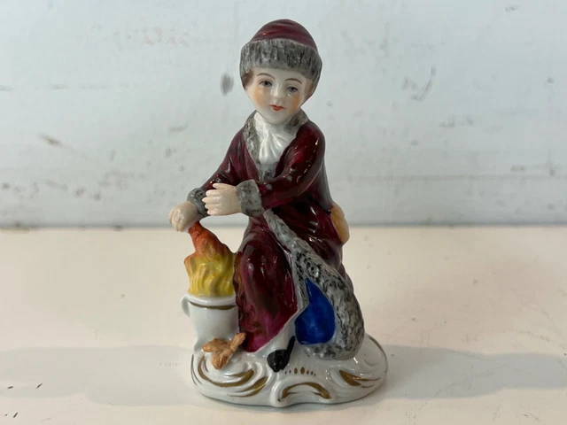 Vintage Early 20th Century Sitzendorf Porcelain Seated Boy with Fire Figurine