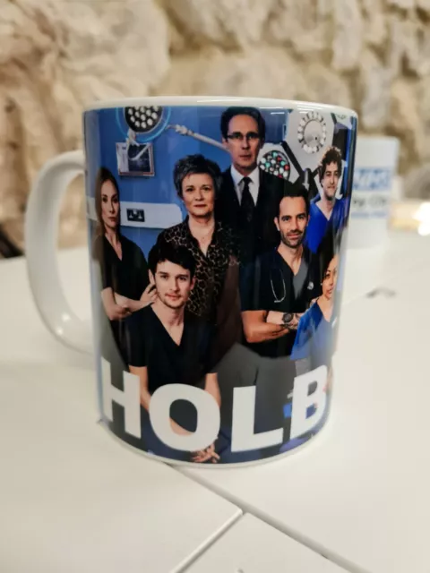 Holby City advertising mug cup featuring 2021 cast Casualty TV