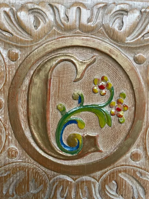A Stunning Carved Panel in oak with the letter C
