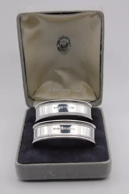 A pretty pair of cased oval sterling silver napkin rings London 1988