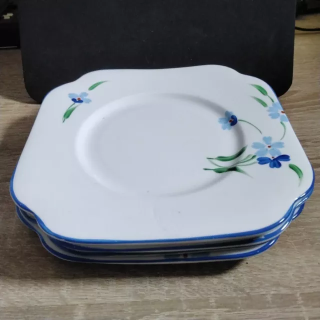 (463) Unmarked White Side Plate With Blue Pansies Pattern.