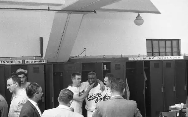 Brooklyn Dodgers Jackie Robinson posing for photograph with teamma - Old Photo 1