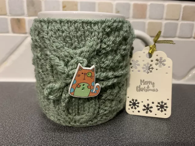 Hand Knitted Green Mug Cosy With Cute Cat Button