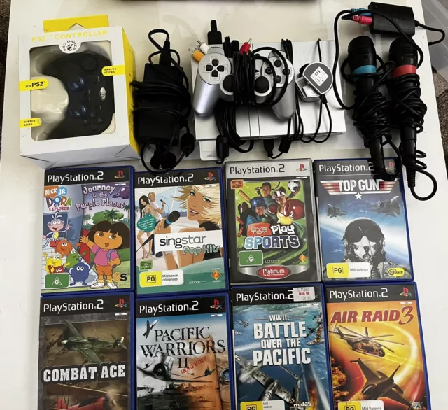PS2 Bundle - Console, Controller, Games, Microphones, Memory Card & Cables.
