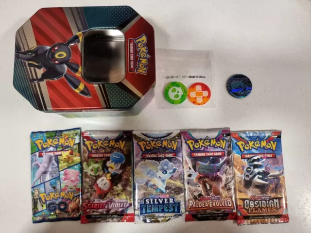 5x Official Sealed Pokemon Booster Packs W/ Tin And Gift