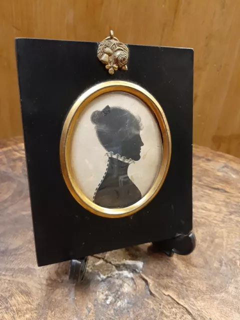 Antique late 18th/early 19th century silhouette portrait of a  Female character.