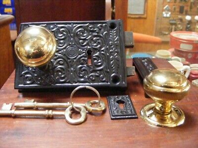 victorian,ornate cast iron rim lock & keeper.with 45 mm milled edge brass knob