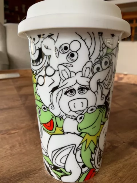 https://www.picclickimg.com/pNcAAOSwRchhazWQ/Disney-Muppets-KERMIT-ALL-Over-Porcelain-Travel-Coffee-Mug.webp