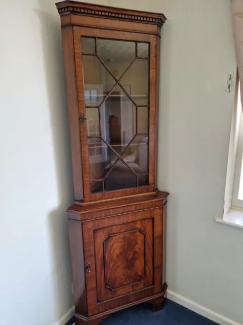 Corner glass-fronted display cabinet