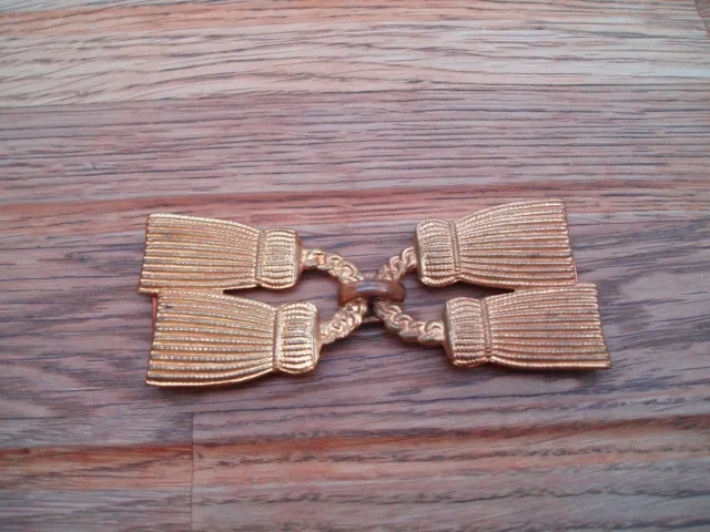 Art Deco pressed metal double buckle in shape of tassels. very good condition