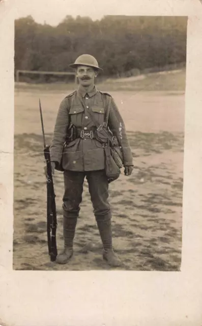 WW1 postcard Tommy Soldier in uniform with rifle