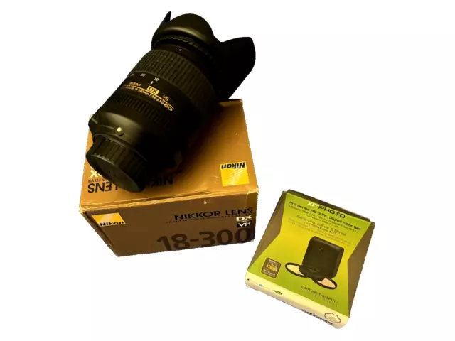 Nikon AF-S DX NIKKOR 18-300mm f/3.5-6.3G ED VR Lens in the box with 3 Pc. Filter