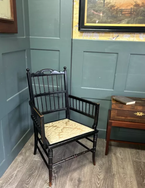 small 19th century ebonised william morris style armchair
