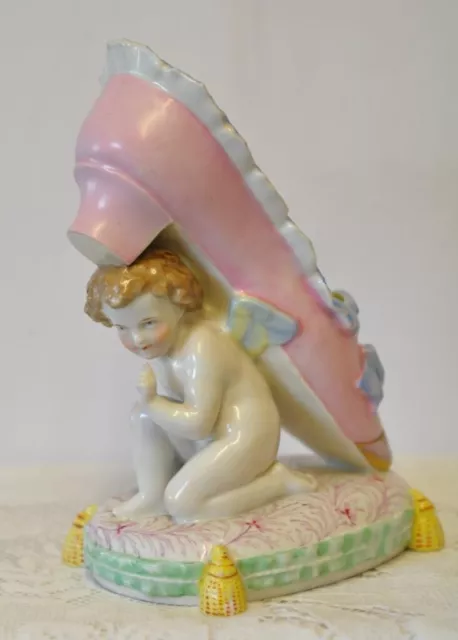 Vintage Porcelain Cherub Holding Shoe Figurine