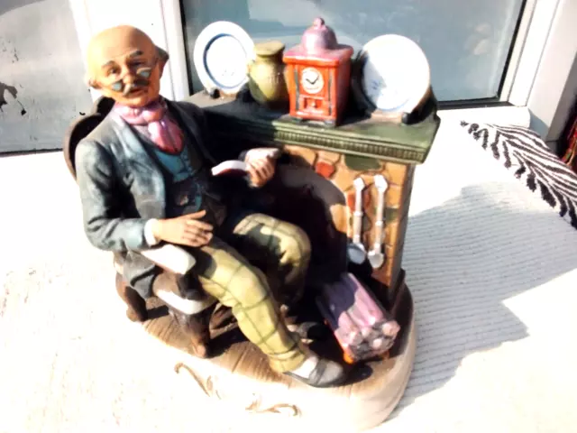 Vintage Ceramic Bisque Figurine Old Man With Book Sitting At Fireplace