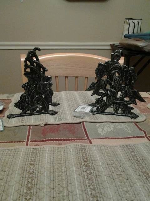 Two Sets Of Decorative Cast Iron Hooks