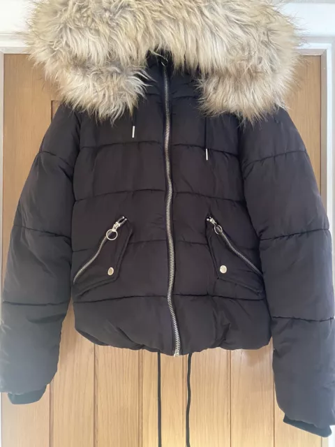 Womans puffer jacket with fur hood