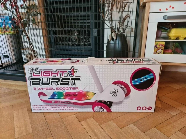 Light burst pink and store white scooter